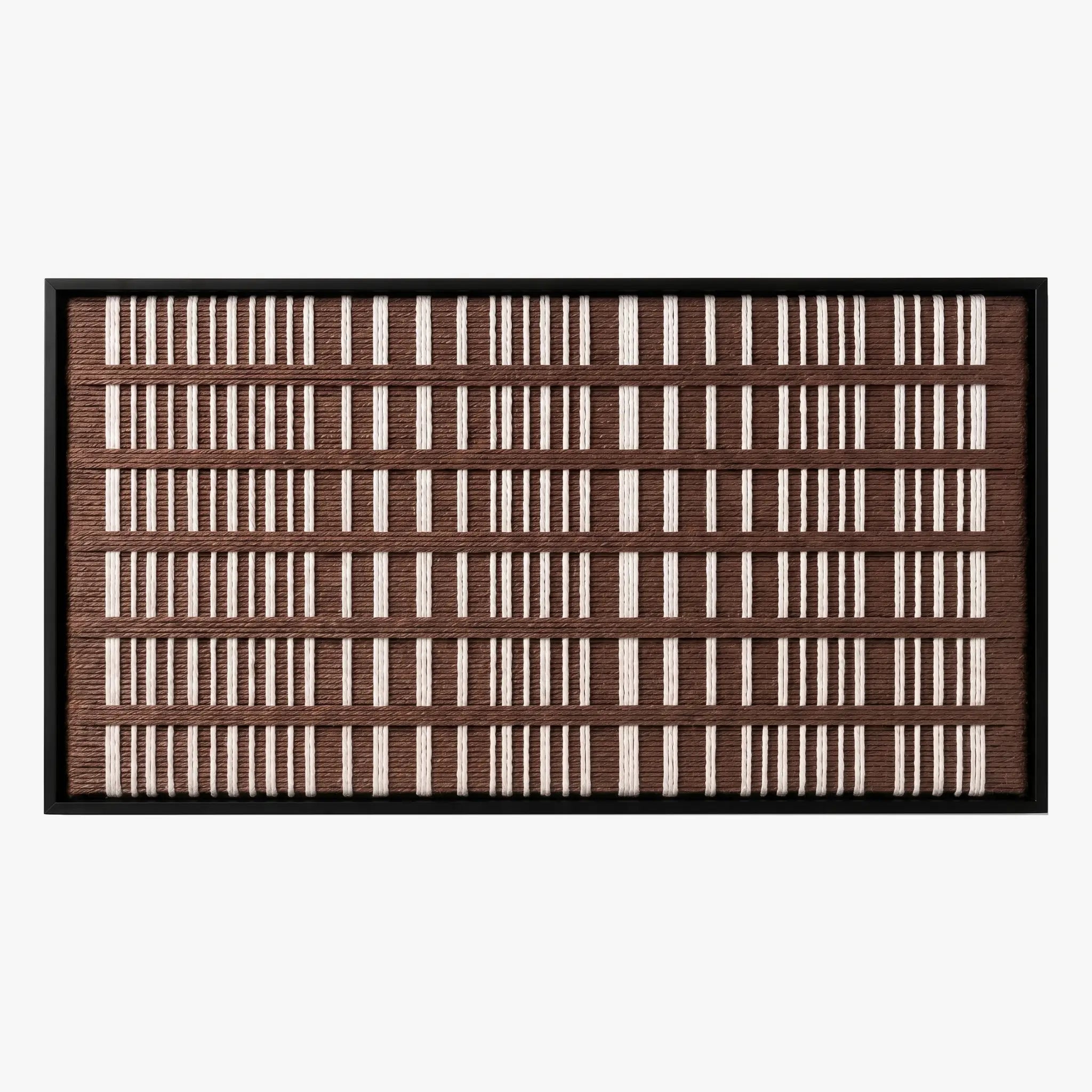 Frontal studio shot of the Cocoa Cadence hand-woven wool wall art featuring a rhythmic brown and cream vertical grid pattern in a black frame.