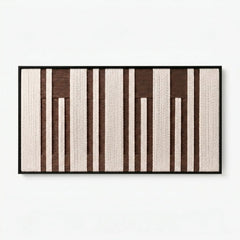 Frontal studio shot of the Cocoa Pillars hand-woven wool wall art featuring brown and cream vertical patterns.