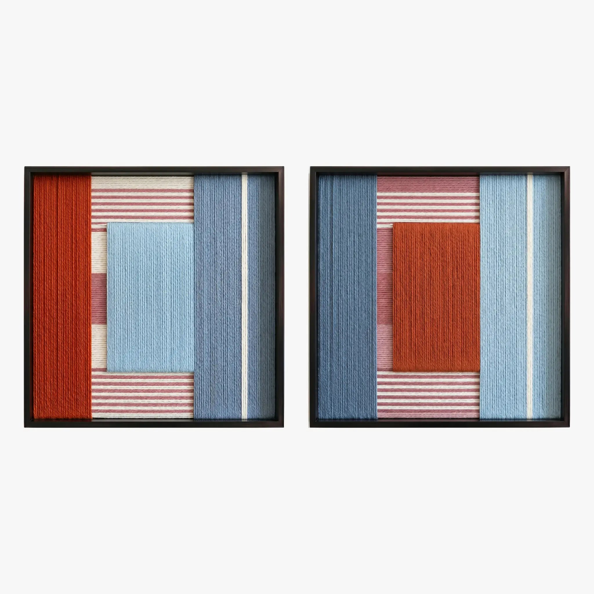 Frontal studio shot of the Cold Fire two-piece hand-woven textile wall art set featuring red and blue geometric color-blocking in black frames.
