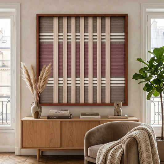 Large square Dusty Tones hand-woven wall art hanging elegantly above a mid-century wooden credenza next to a cozy beige armchair.