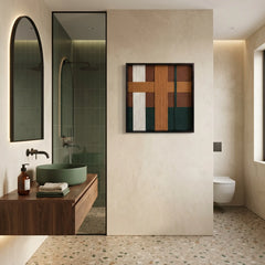 Modern earth-toned textured wool wall art styled in a luxury bathroom above a floating wood vanity with a green vessel sink.