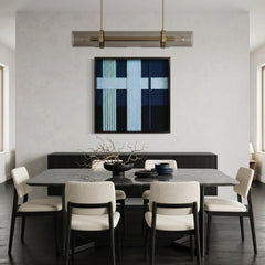 Modern blue and navy fiber wall art styled in a contemporary dining room with a dark table and white designer chairs.