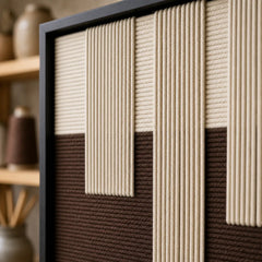 Detailed macro close-up of the Ivory Loom hand-woven wool tapestry highlighting thick cream and brown textured yarn.