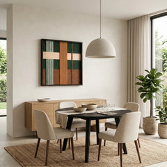 Modern earth-toned wool tapestry displayed in a contemporary dining room with light beige chairs and a minimalist pendant light.