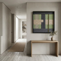 Hand-woven wool tapestry creating a serene focal point in a modern foyer above a minimalist wooden console table.