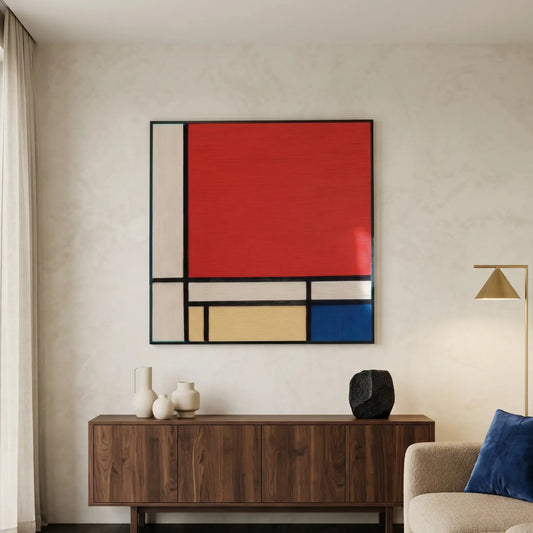 Large hand-woven wool wall art in a Mondrian style featuring bold red and blue geometric blocks above a dark wood sideboard.
