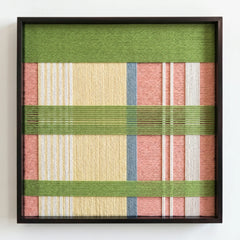 Frontal studio shot of the Pastoral Lullaby hand-woven wool wall art in a square black frame against a clean white background.