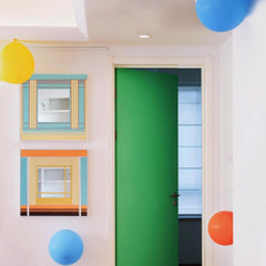 Close‑up of Pear Blossom Tree yarn mirror art revealing looped wool texture of the green and wood stripe panels against the reflective glass.