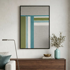 Large hand-woven wool wall art featuring teal and olive green geometric patterns displayed above a dark walnut sideboard.