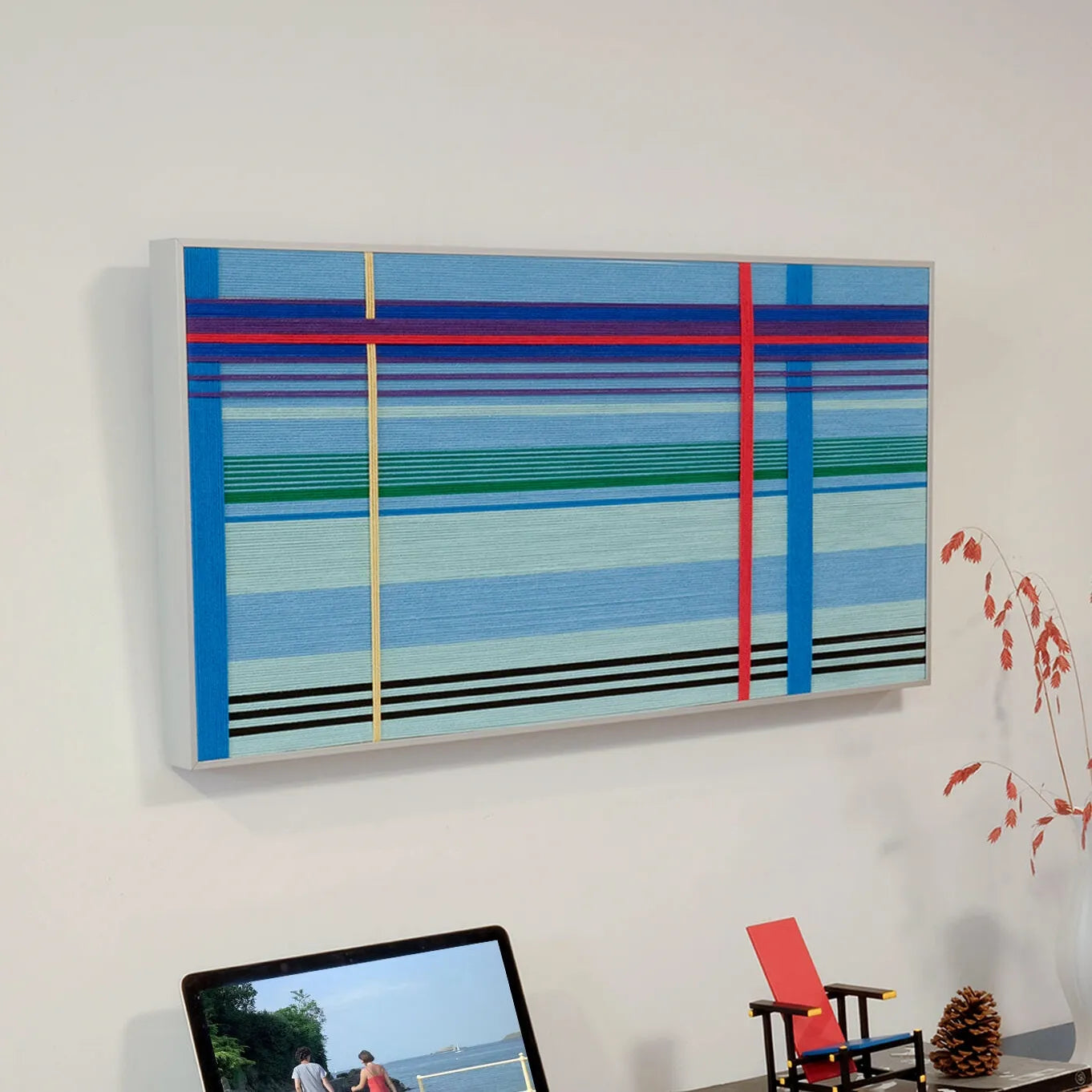 Close-up of Summer Story yarn wall art revealing the looped wool texture and crisp transitions between stripe colors