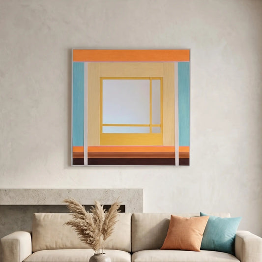 Large hand-woven wool wall art in warm orange and teal tones displayed above a cream sofa with pampas grass decor.