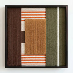 Professional studio shot of the Sylvan Glow hand-woven wool wall art in a square black frame against a clean white background.