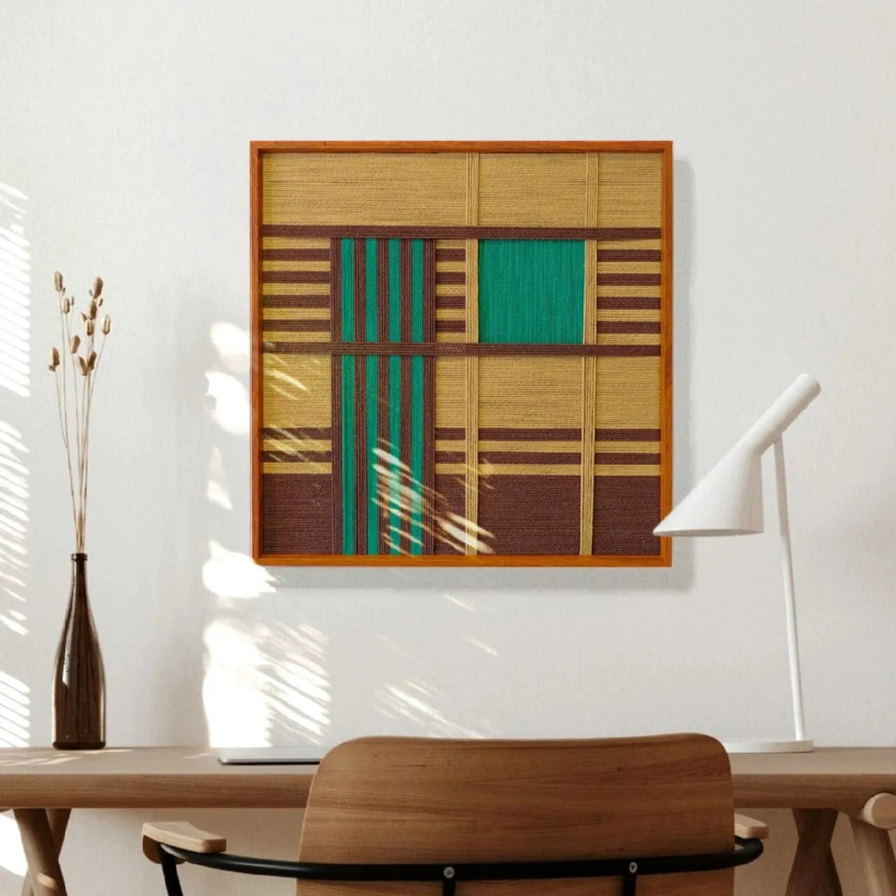 Vast Horizon yarn wall art with precise stripe alignment, styled on a desk beside a white lamp to showcase its balanced geometric design