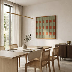 Large-scale textured fiber wall art hanging in an open-concept dining room with a long table and designer lighting.