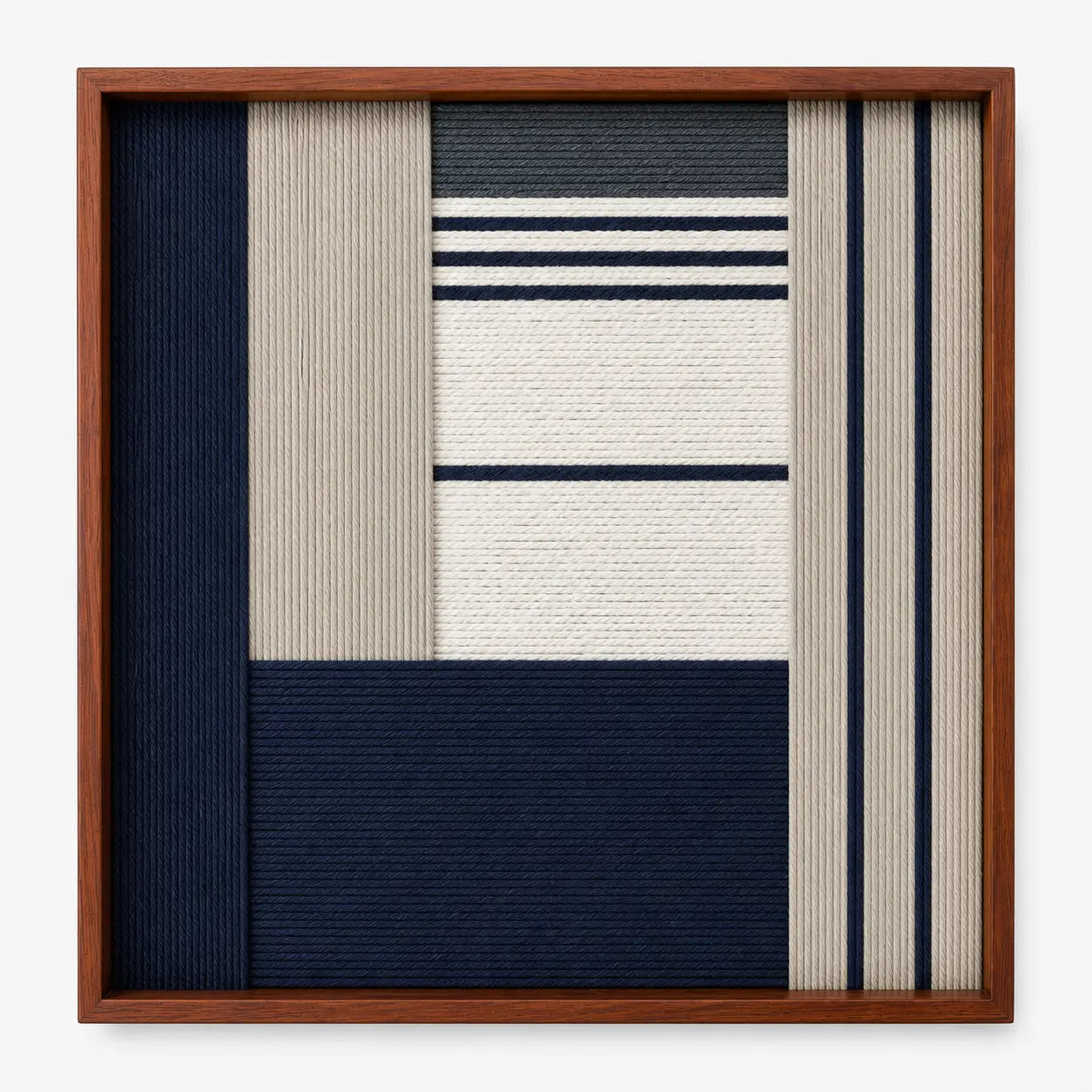 Frontal studio shot of the Baltic Window square hand-woven textile wall art featuring navy blue, beige, and white geometric blocks in a warm wooden frame.