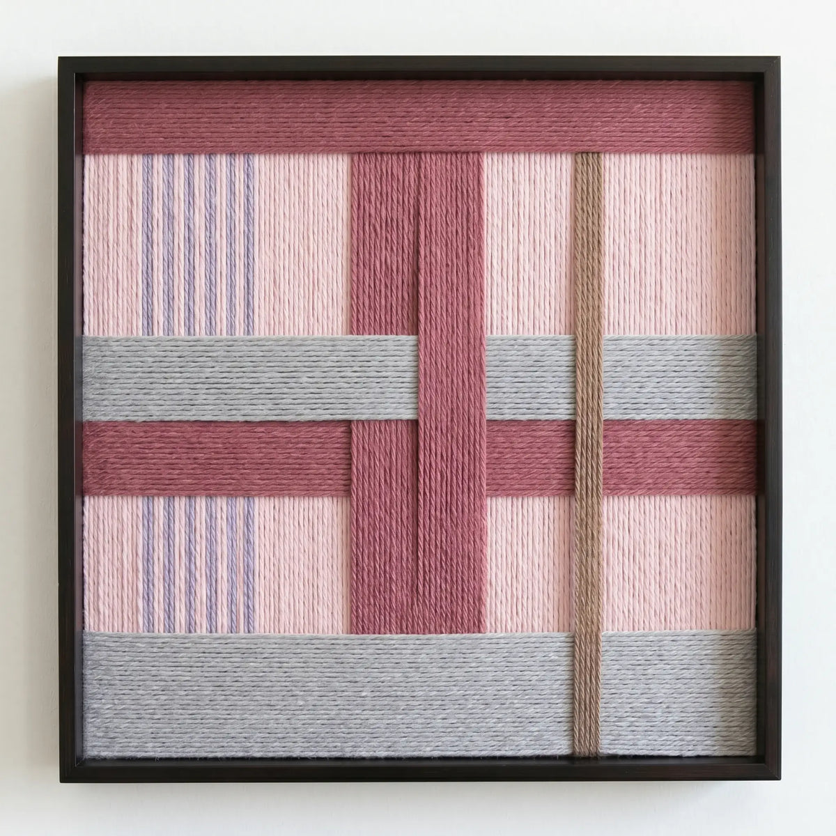 Frontal studio shot of the Bloom Forecast hand-woven wool wall art in a square black frame against a clean white background.