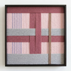 Frontal studio shot of the Bloom Forecast hand-woven wool wall art in a square black frame against a clean white background.
