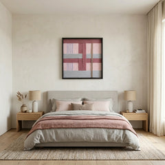 Textured fiber wall art in dusty rose and grey tones styled as a focal point above a bed in a serene, minimalist bedroom.
