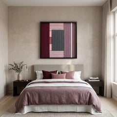 Framed textured wool wall art styled in a serene bedroom as a headboard focal point, complementing mauve and burgundy linens.