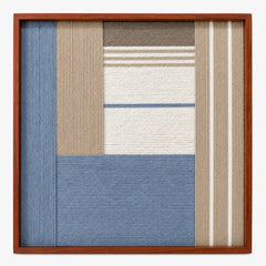 Frontal studio shot of the Cerulean Mist square hand-woven textile wall art featuring light blue, beige, and white geometric blocks in a warm wooden frame.