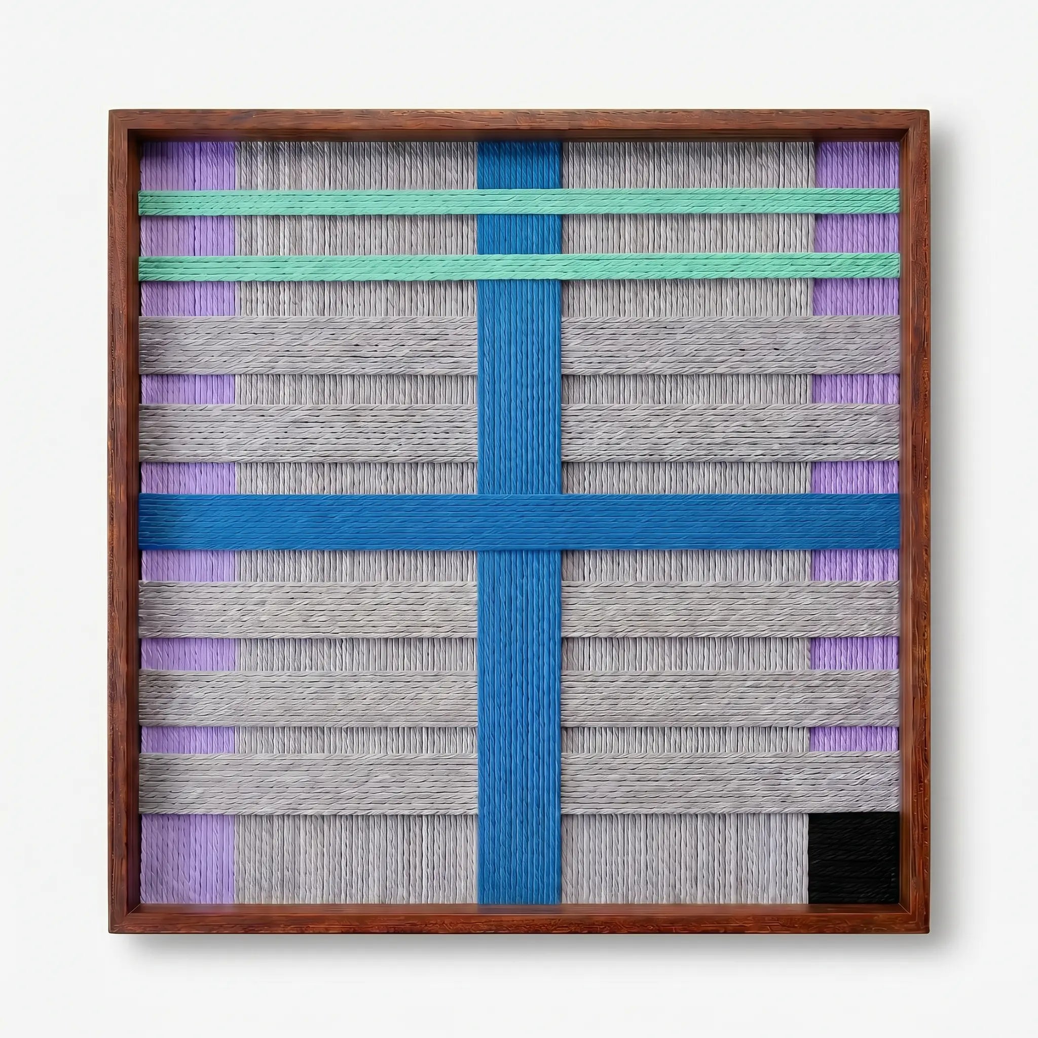 Frontal studio shot of the Cobalt Window hand-woven wool wall art featuring a bold blue cross and mint green stripes in a wooden frame against a clean white background.