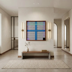 Square blue and grey textured wool art creating a vibrant focal point in a minimalist home entryway above a low wooden bench.