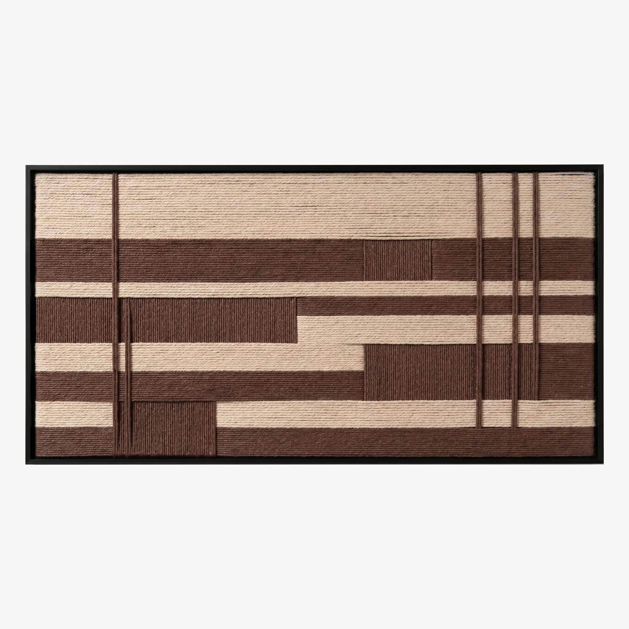Frontal studio shot of the Cocoa Grid hand-woven wool wall art featuring brown and cream geometric grid patterns in a black frame.