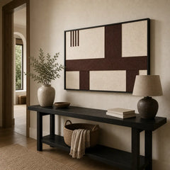 Striking Cocoa Horizon framed wall art styled in a bright entryway hallway hanging above a sleek black console table.