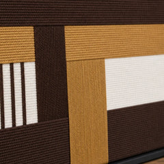 Detailed macro close-up of the Cocoa Loom hand-woven wool tapestry highlighting the thick brown, beige, and white intersecting yarn textures.