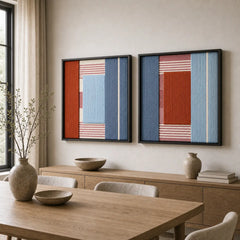 The Cold Fire geometric hand-woven wool tapestry set provides a striking focal point over a wooden sideboard in a contemporary dining room.