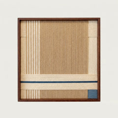Close-up front view of A Collected Morning hand-woven wool wall art showing the intricate vertical weaving and dark wood frame details.