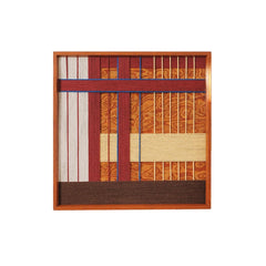 Front view of the second Festive Harmony design variation with a complex grid of red, orange, and blue hand-woven wool textures.