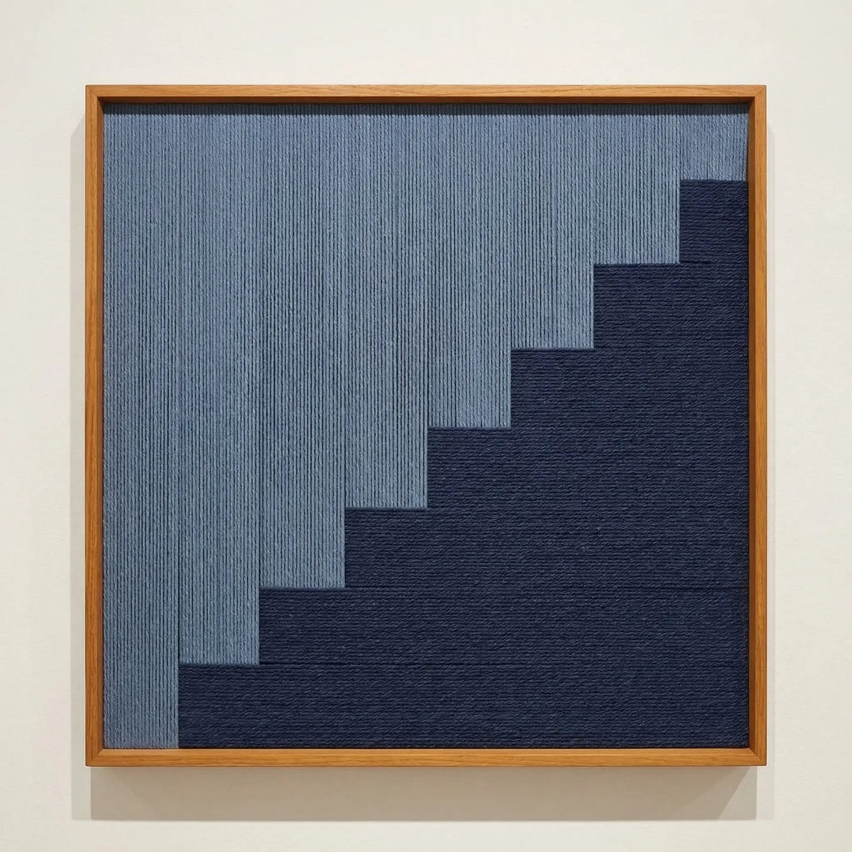 Direct front view of The Eighth Level hand-woven wool tapestry in a wooden frame, showcasing the tiered geometric weave and fiber texture.