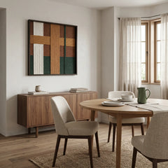 Square forest green and terracotta wool tapestry creating a sophisticated focal point in a contemporary dining room with light oak furniture.