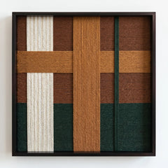 Frontal studio shot of the Emerald Fables hand-woven wool wall art in a square black frame against a clean white background.