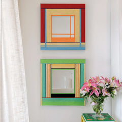 Two variations of the Fields of Blossoms woven mirror collection hanging vertically, comparing the red and green colorway options.