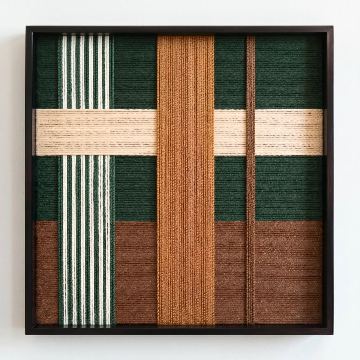 Frontal studio shot of the Jade Manor hand-woven wool wall art in a square black frame against a clean white background.