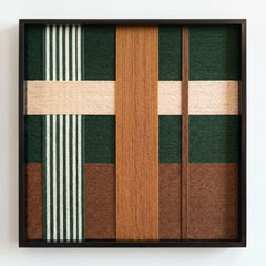 Frontal studio shot of the Jade Manor hand-woven wool wall art in a square black frame against a clean white background.