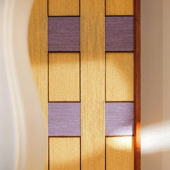 Close-up of Lavender Fields hand-woven wool wall art showing the intricate yellow and purple vertical yarn winding and wood frame.
