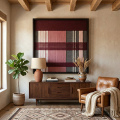 Earth-toned Merlot Veil framed wall art styled elegantly above a dark wood mid-century credenza next to a classic leather armchair and potted plant.