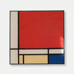 Professional studio shot of the Mondrian inspired hand-woven wool wall art in a black frame against a clean white background.