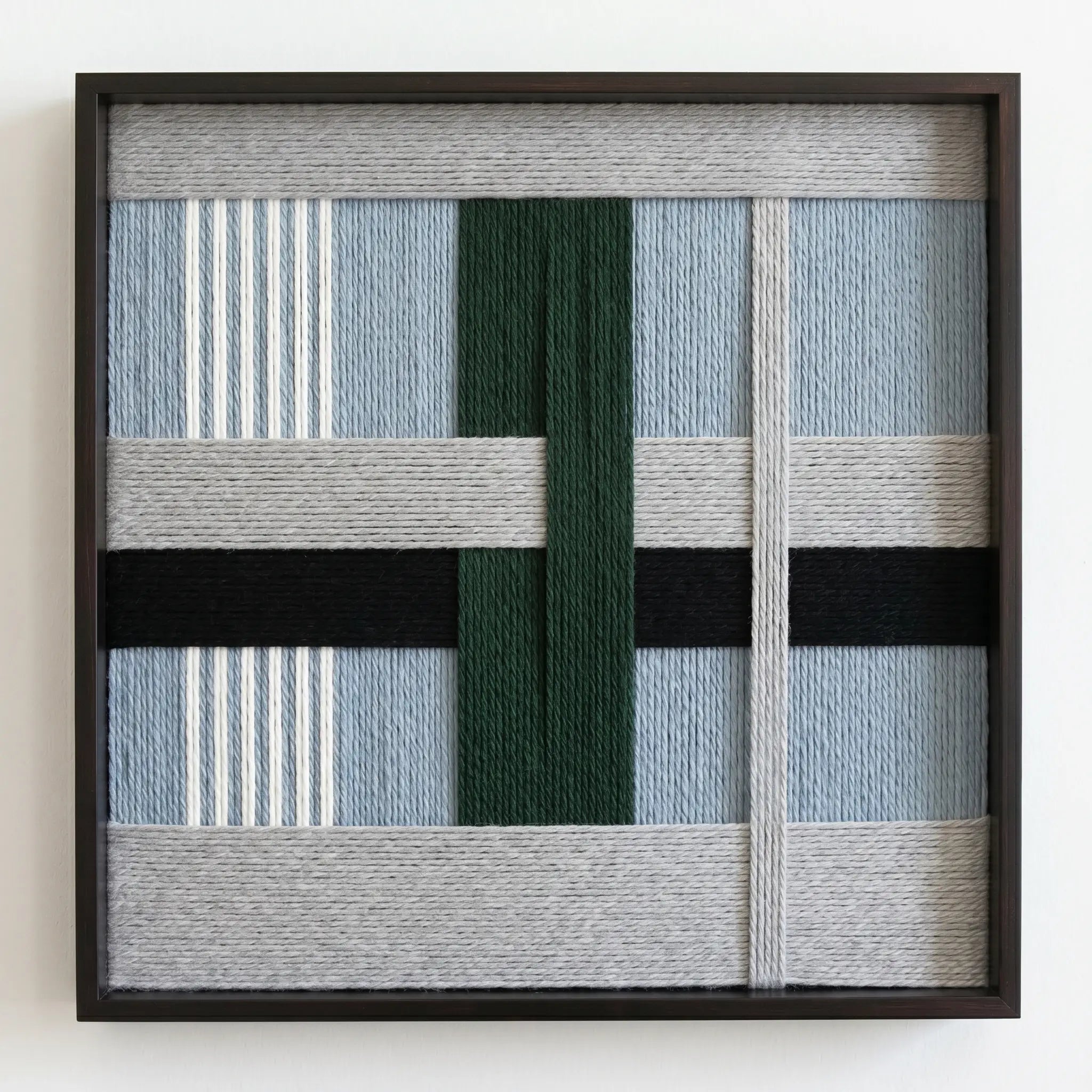 Frontal studio shot of the Moonlight Glade hand-woven wool wall art in a square black frame against a clean white background.