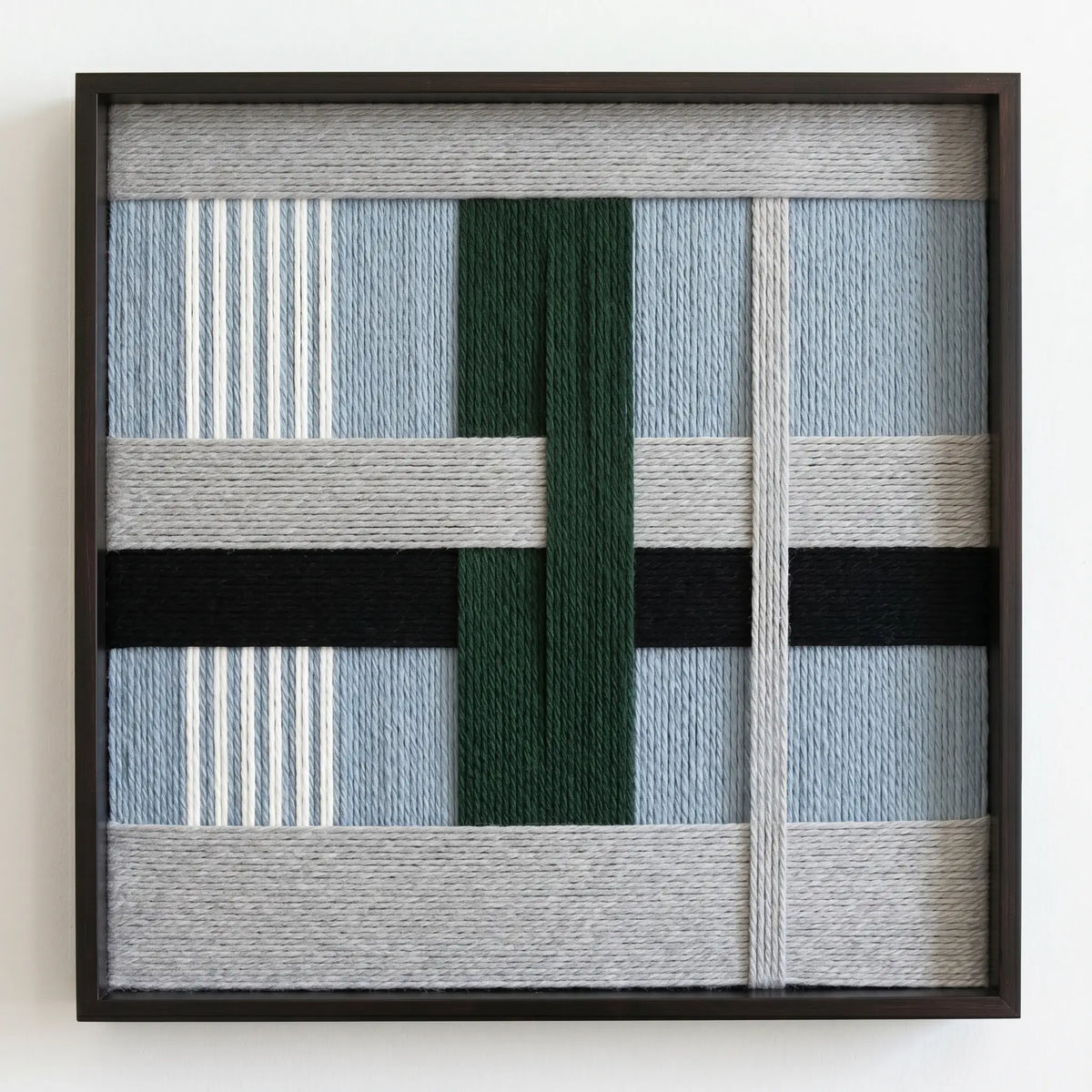 Frontal studio shot of the Moonlight Glade hand-woven wool wall art in a square black frame against a clean white background.