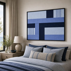 Nordic Tide geometric framed wall art creating a calming focal point in a cozy bedroom above a neatly styled blue bed.