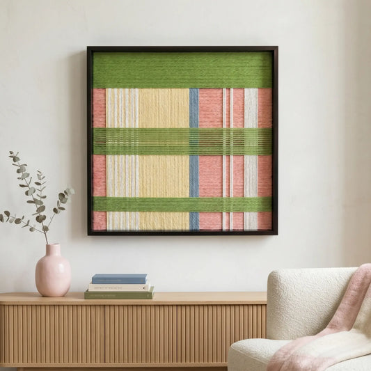 Pastoral Lullaby hand-woven tapestry styled in a sunlit living room above a light oak sideboard with a pink ceramic vase.