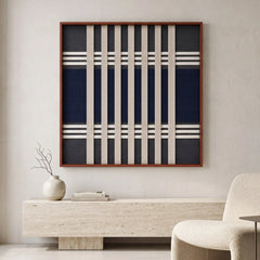 Sophisticated Polar Meridian hand-woven tapestry hanging above a modern stone console table in a bright, minimalist interior space.