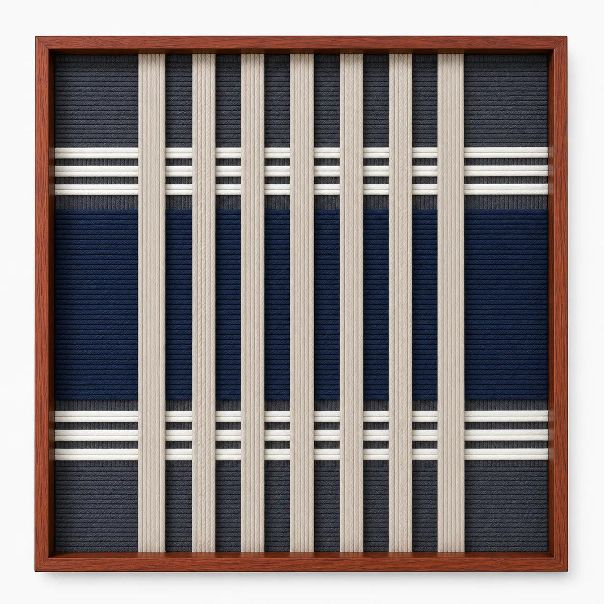 Frontal studio shot of the Polar Meridian square hand-woven textile wall art featuring navy blue geometric blocks and crisp white vertical stripes in a wooden frame.