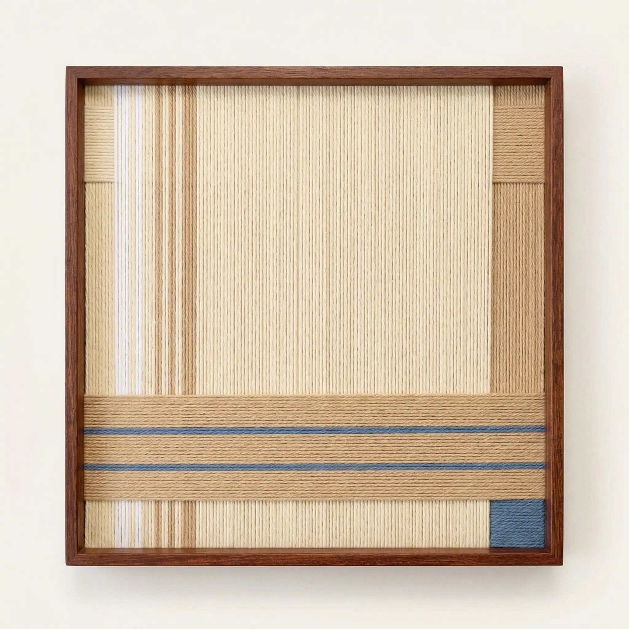 Frontal studio shot of the Shadow at 4 PM hand-woven wool wall art in a square wooden frame against a white background.