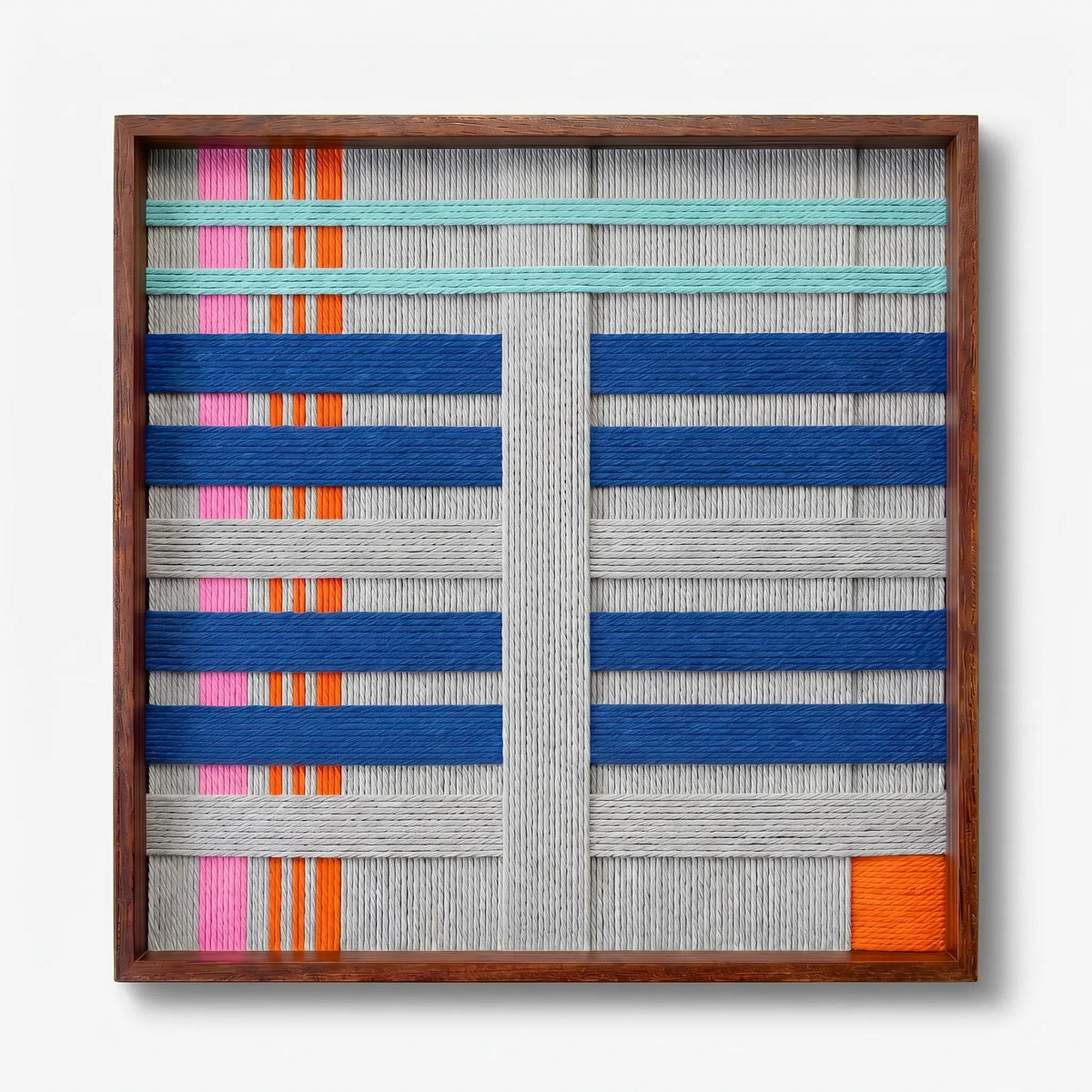 Frontal studio shot of the Silent Dopamine hand-woven wool wall art featuring colorful blue and orange geometric patterns in a wooden frame against a clean white background.