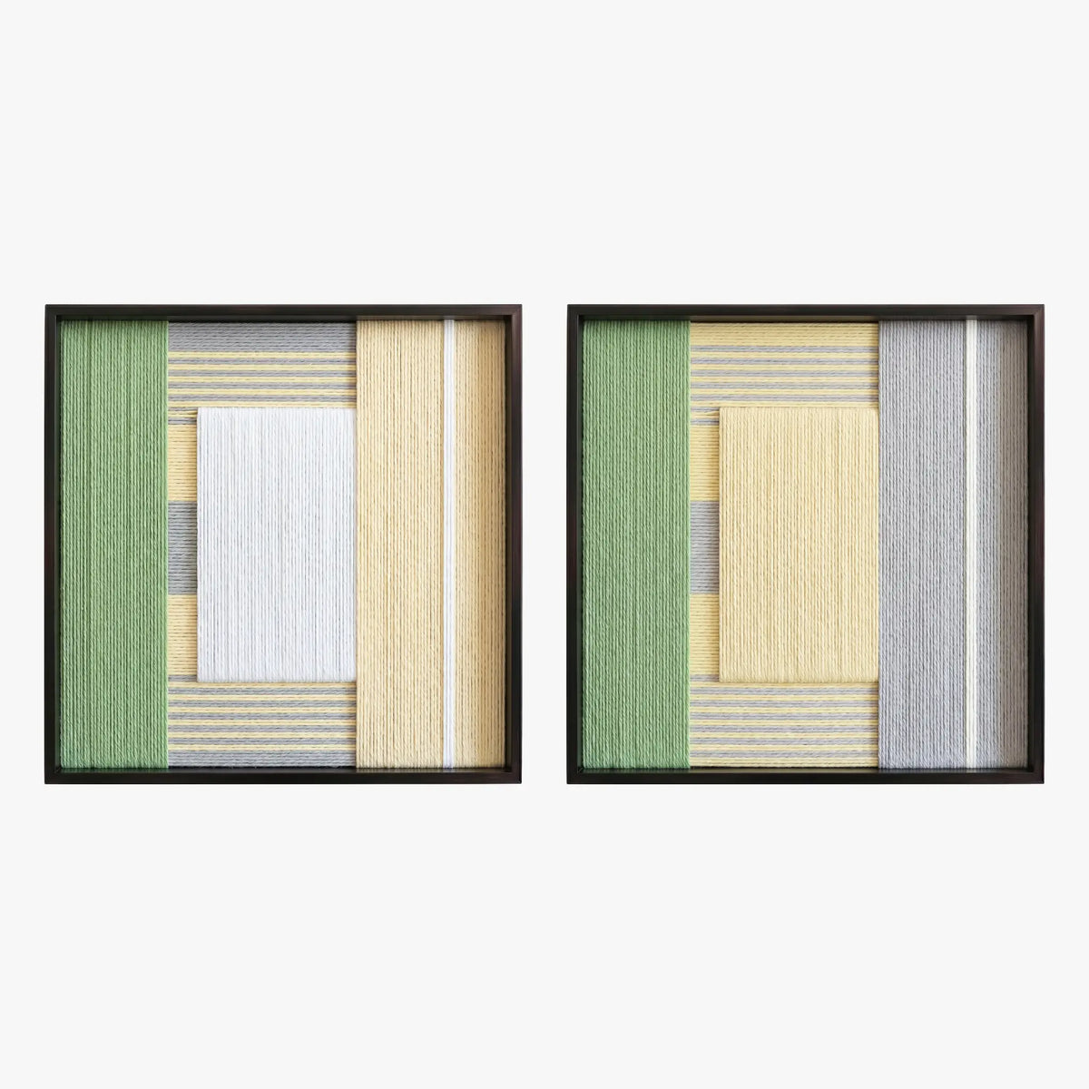 Frontal studio shot of the Sun-Baked textile art pair, showcasing two matching square hand-woven wall art pieces with yellow, white, and green geometric designs in black frames.